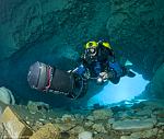 John Katerenchuk scooters into Jackson Blue cave system with his HammerMeg on his back and using a UV-18.