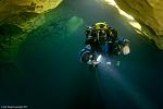 John Katerenchuk doing deco after a 265' cave dive into Eagle's Nest, along the upstream section. The chimney entrance can be seen in the center of...